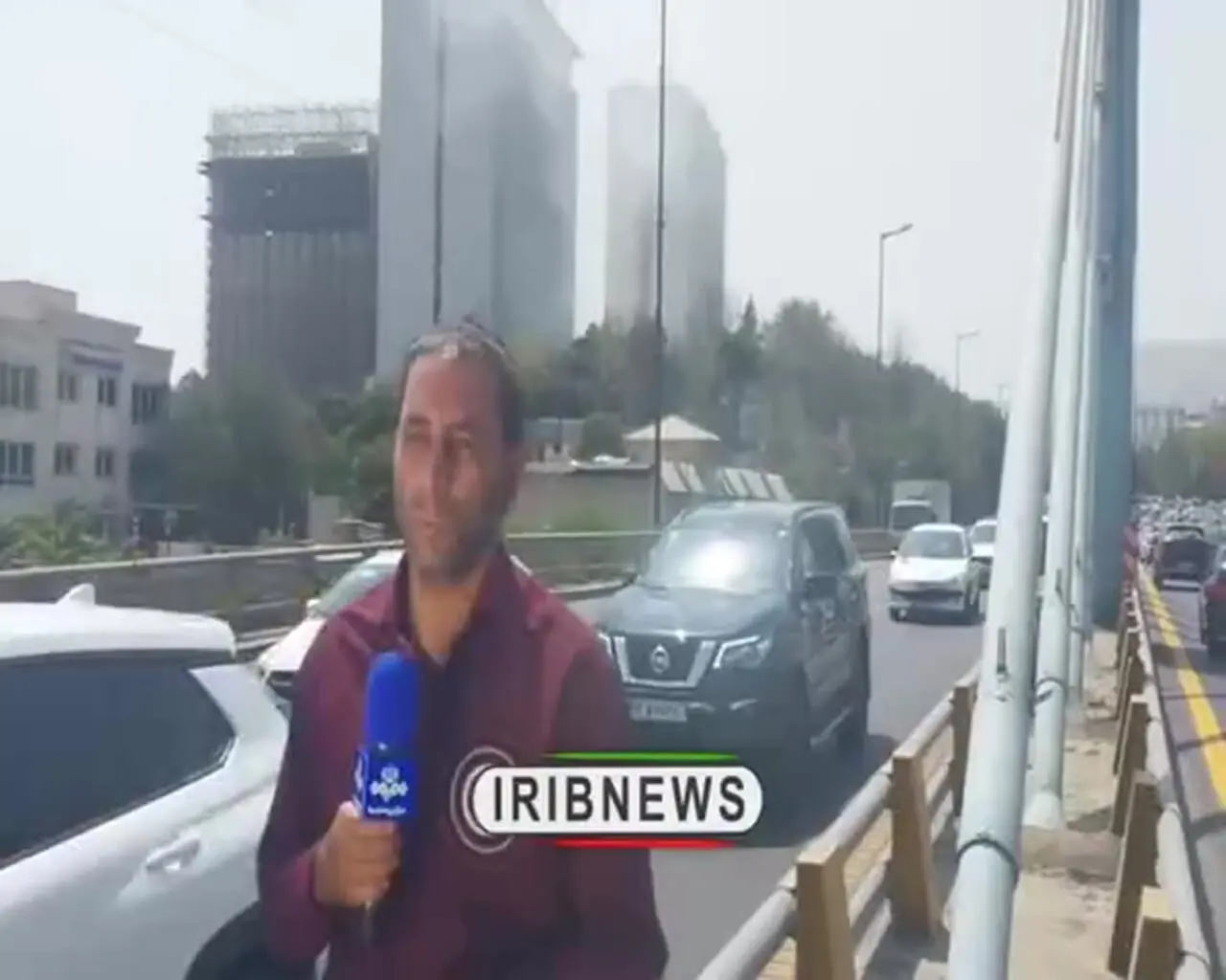 تصاویری از کتک خوردن خبرنگار صداوسیما در آتش‌سوزی هتل استقلال